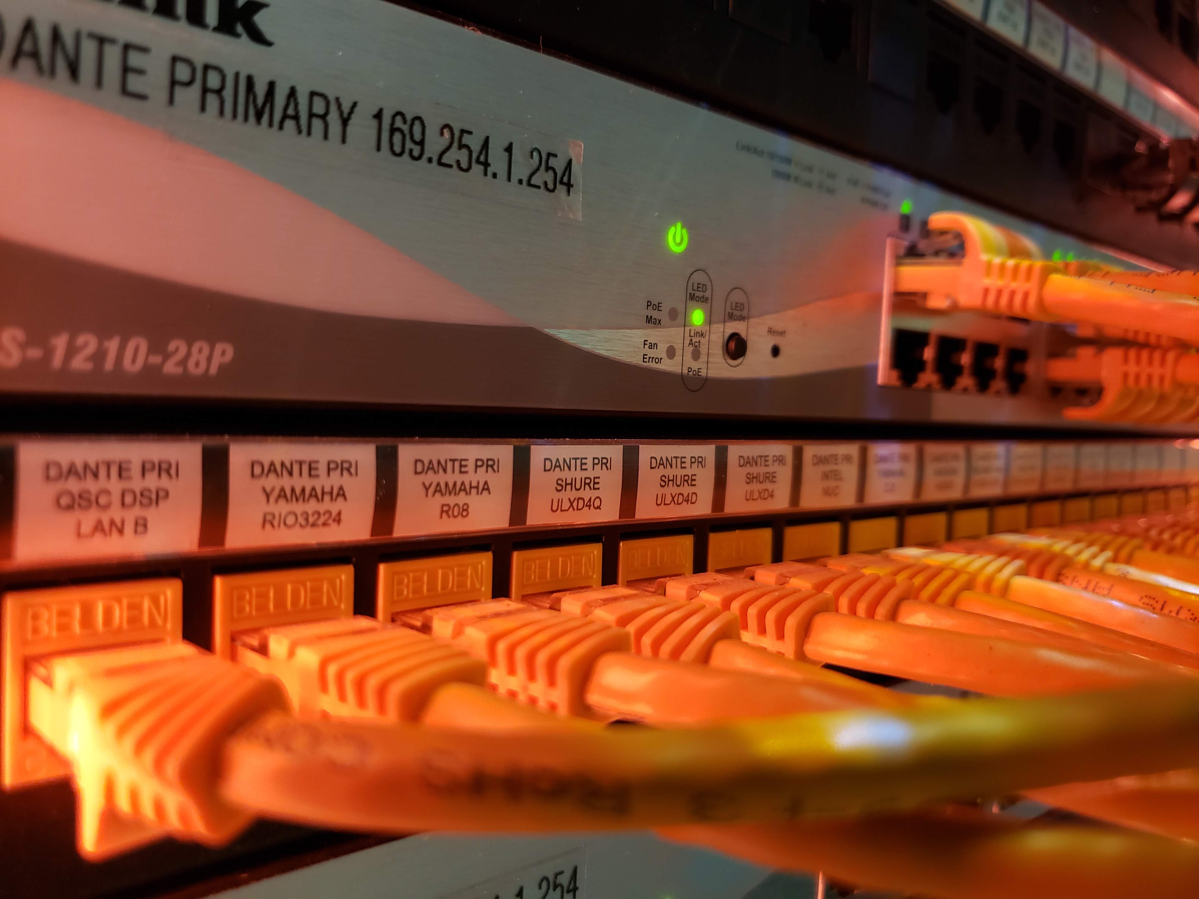 Labeled Dante primary switch and patched Belden cabling